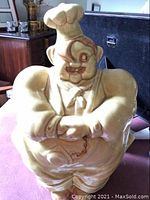 Front view of ceramic chef-shaped cookie jar with detailed facial expression and chef hat.