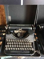 Front view of the vintage Underwood typewriter with visible keyboard and the Underwood logo on the back.