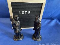 Photo of two Asian sculptures believed to represent Confucius, standing about 6 inches tall, polished wood or resin, in very good condition.