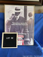 Front view of framed black and white Smirnoff advertisement with man in suit and hat and prominent text, including visible chip in top right of glass.