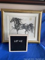 Framed black and white horse sketch print shown with Lot 42 sign in front
