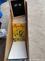 Cardboard box of sleeved comics with Paper Girls #1 visible at front
