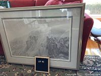 Full view of framed Robert Bateman limited edition print showing snowy cliff landscape with wolves.