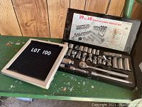 Photo showing the entire 29 piece ratchet socket set laid out in the metal case with an open lid revealing detailed sticker labeling the contents.