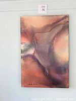 Front view of abstract painting showing swirling metallic orange, purple and brown hues