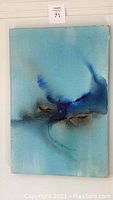 Full front view of abstract acrylic painting with light blue background and darker blue and brown accents