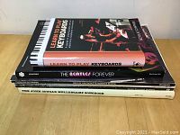 Stack of six music related books showing titles and condition.