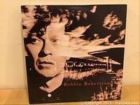 Robbie Robertson vinyl LP record front cover showing artist portrait with an artistic overlay effect.