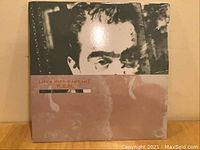 Front cover of Lifes Rich Pageant with close-up face art.