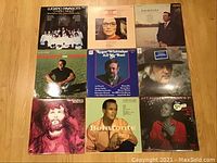 Photo showing 9 vinyl record album covers including Luciano Pavarotti, Jim Reeves, Roger Whittaker, Harry Belafonte, and others.