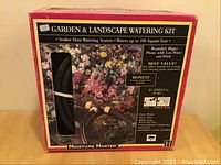 Boxed Garden & Landscape Watering Kit labeled Moisture Master, includes hose watering system for up to 1800 square feet.