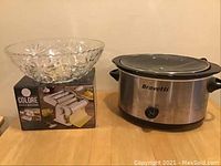 Photo showing glass punch bowl on pasta maker box and Bravetti slow cooker
