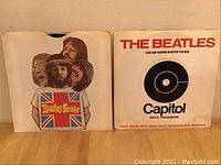 Two paper sleeves: Beatles collage "Beatles Forever" and white Capitol sleeve for "Long and Winding Road" single