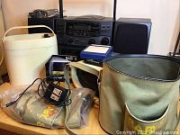 Optimus stereo with two Baby 8 players and their cases on table, visible power adapter and cords included.