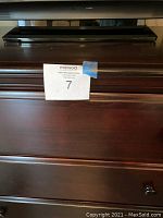 Close-up of the chest showing wood finish, dovetail drawer joinery and drawer pulls.