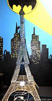 Front view of Eiffel Tower decoration showing blue ombre sequins and height.