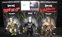 Front view of all three sealed horror action figures in blister card packaging: Jason Voorhees, Pinhead, Freddy Krueger.