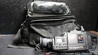 Sony Handycam Pro Video8 camera and black Tamrac travel bag from side view
