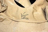 Close-up of Valentina body shaper label, made of 90% nylon and 10% spandex, size XL, gentle wash instructions