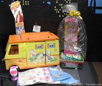 Vintage Barbie Country Camper 1970 and Barbie merchandise including pink potty seat, Barbie underwear, Easter basket with doll and candy