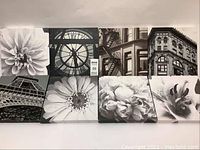 Full view of all 8 canvas prints arranged in two rows of four. Prints display floral and architectural black and white images.