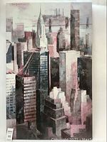 Front view of large canvas artwork featuring abstract cityscape in muted shades.
