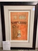 Frontal image of framed giclee print showing artwork, artist signature, frame condition, and certificate of authenticity placed in front of the frame.
