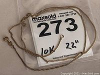 Full view of 10k gold chain with note showing "10k - 22"