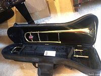 Getzen trombone assembled in open black soft case