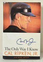 Front cover of the signed Cal Ripken Jr. book 'The Only Way I Know' showing Cal Ripken Jr.'s signature and photo of him wearing a helmet.