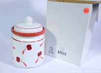 Front view of the Dansk Bing Cherries lidded jar alongside its original box showing product labels.