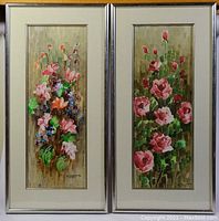 Two framed oil paintings showing floral arrangements with signature N. Cajati visible on both artworks.