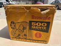 Original Kodak Yellow Cardboard Box for Brownie 500 Movie Projector 8mm, showing wear and damage