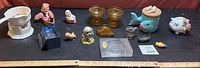 Full lot of assorted vintage glassware and knickknacks on display, showing size and variety.