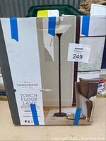 Threshold torch floor lamp box showing product image and labeling.