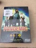 Box top of sealed Pandemic board game showing cover art and title.