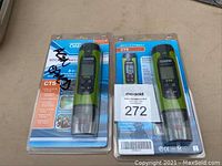 Two Oakton EcoTest CTS water testers in original blister packaging with blue backs, placed on a table.