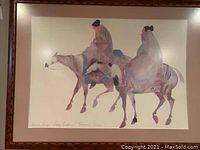 Full view of the framed picture showing two women riding horses, signed by Carol Gringa Gangle. Frame and mat visible.