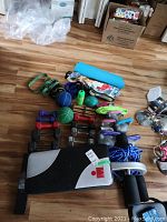 Front view: bench, dumbbells, kettlebells, ropes, medicine balls, yoga mat