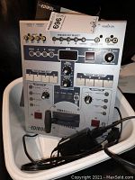 Front view of Edirol video switcher showing input/output ports, input select buttons, effects control, and transition knob.