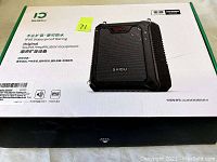 Box with Shidu Portable Voice Amplifier SD-M900 branding showing model, IPX6 waterproof rating, and original sound amplification equipment labeling.