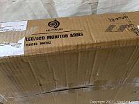 Box label showing Huanuo HNCM2 model LED/LCD monitor arms.