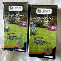 Two boxed Garden Secrets Moles and Snakes Repellent devices GS-503 side by side.