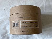 Photo of the Gobe circular lens filter kit box showing branding and notes about environmental impact (5 trees planted).