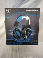 Box front showing Beexcellent BM-1 Pro Gaming Headset with blue and black design and lightning graphic.