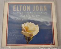 Elton John sealed CD single with cover showing a white rose on a blue sky background.