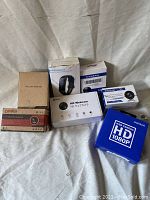 Image showing all seven items from front angle, highlighting brand names and box conditions.