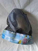 Snorkeling mask pack inside black mesh bag with visible label showing model M2068G S/M size and color Blue.