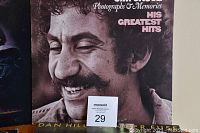 Close-up of Jim Croce's Photographs & Memories His Greatest Hits vinyl album cover showing the artist smiling.