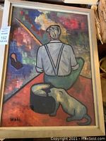 Full view of the framed painting showing a seated figure fishing and a cat at his side with abstract background